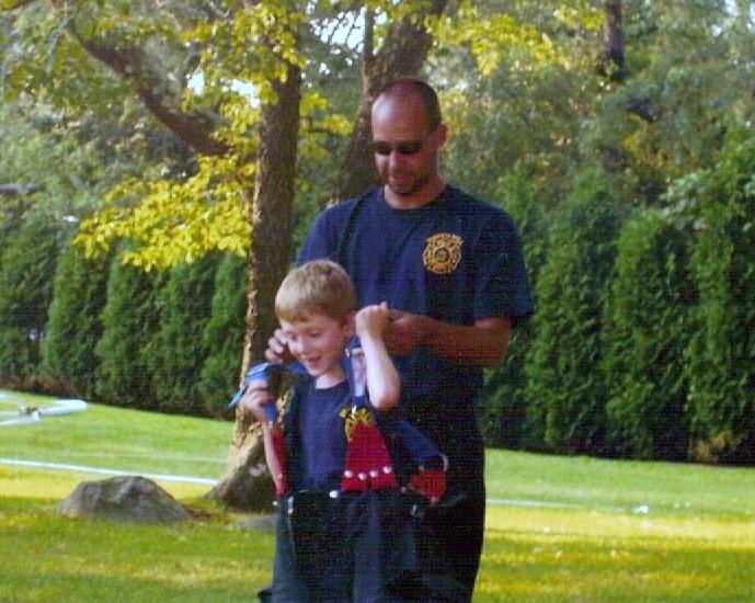 Assistant Chief Jason Simmons and Rees Harold at an open house.